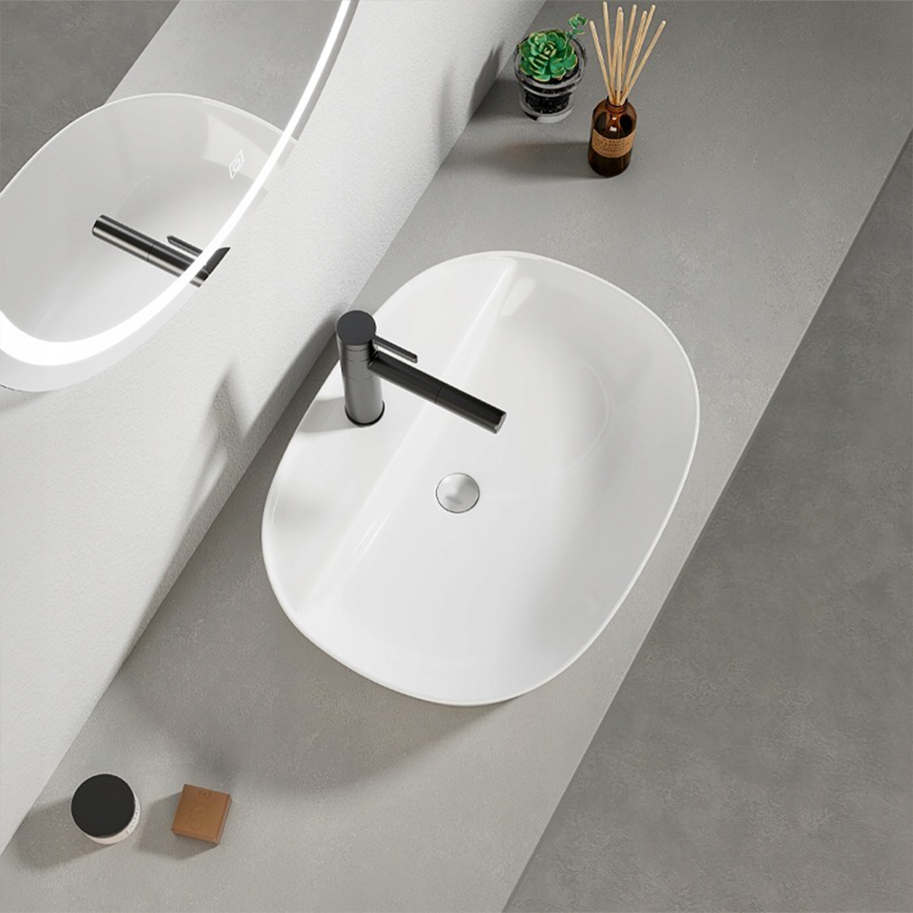 Owalna umywalka z białej ceramiki 50x38 cm – blatowa, z otworem na baterię