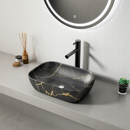 Czarna umywalka nablatowa 46,5×33 cm - matowy marmur ze złotymi żyłkami, owalny kształt